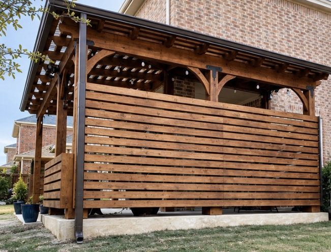 Cedar pergola with horizontal slat privacy wall