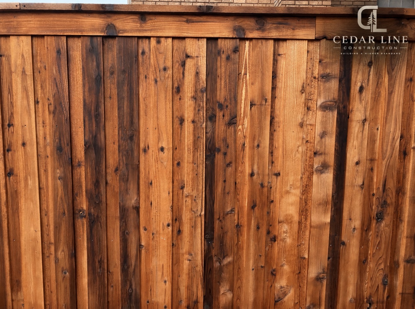 Stained cedar board-on-board privacy fence
